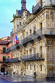Leon Town Hall, old Gothic building with multiple windows and balconies with bars. photo
