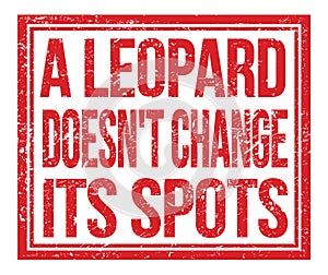 A LEOPARD DOESN`T CHANGE ITS SPOTS, text on red grungy stamp sign photo