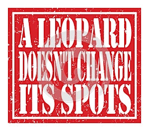 A LEOPARD DOESN`T CHANGE ITS SPOTS, text written on red stamp sign photo