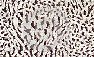 Leopard print on thick mass-produced upholstery fabric. Animal skin abstract pattern. Camouflage background from brown spots