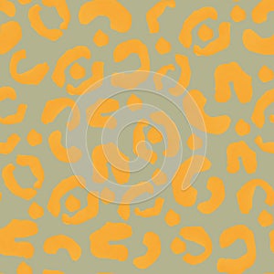 Leopard spots yellow on gray seamless pattern