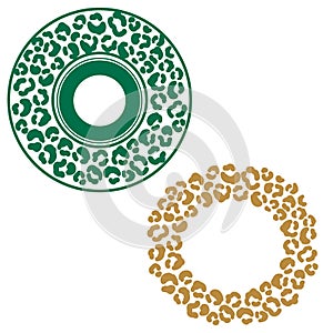 Leopard stains round frame ornament. Green and gold cheetah spots circle border.