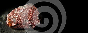 Lepidocrocite is a rare precious natural stone on a black background. AI generated. Header banner mockup with space.
