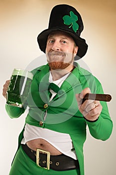 Leprechaun drinking green beer