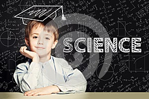 Lern Science. Clever student child on blackboard background photo