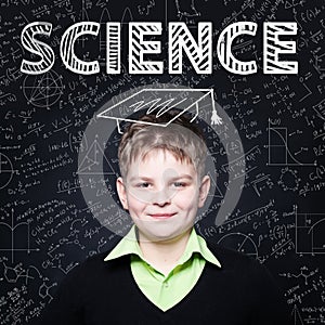 Lern Science. Clever student child on blackboard background photo
