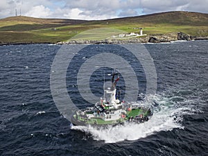 The Lerwick Pilot Boat the Knab, approaches a Vessel ready to board the Pilot in heavy seas in Bressay Sound photo