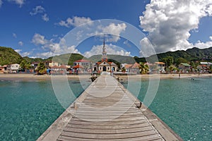 Les Anses d`Arlet - Martinique - View to the city and the church from the pier photo