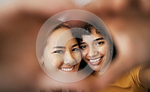 Lesbian couple, smile and heart with hands, portrait and closeup for romance, bonding and love and support for