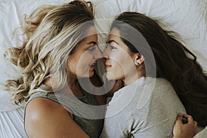 Lesbian couple together in bed