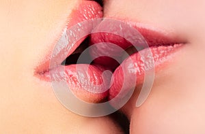 Lesbian kisses. Caucasian couple kissing. Kiss Close up.