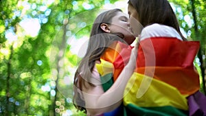 Lesbians kissing outdoor, minority rights protection, public declare of equality