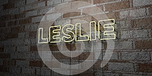 LESLIE - Glowing Neon Sign on stonework wall - 3D rendered royalty free stock illustration