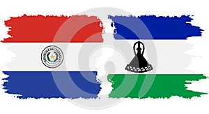 Lesotho and Paraguay grunge flags connection vector