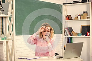 IT Lesson with Computer. e-learning concept. modern technology. girl Study Online in Classroom. teacher woman. tired