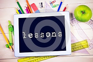 Lessons against students table with school supplies