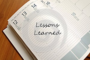 Lessons Learned Concept oved wooden background