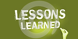 Lessons Learned written on a chalkboard. Education or business concept
