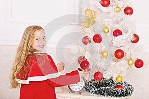 Let kid decorate christmas tree. Favorite part decorating. Getting child involved decorating. Girl long hair hold balls