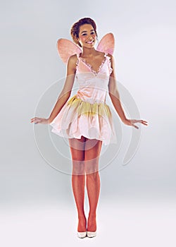 Let me bring magic to your world. A full length shot of a cute fairy.