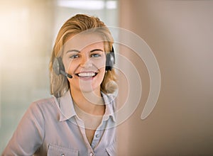 Let me help you. Cropped portrait of an attractive young woman working in a call center.