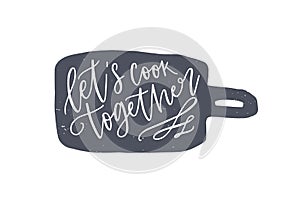 Let`s Cook Together phrase handwritten on cutting board. Slogan or text written with cursive calligraphic font on