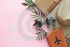 Let`s Go on an Adventure text passport with plane,hat and sungla