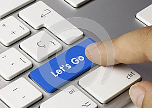 Let`s go - Inscription on Blue Keyboard Key photo