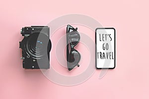 Let`s go Travel text on stylish black smartphone screen,sunglas