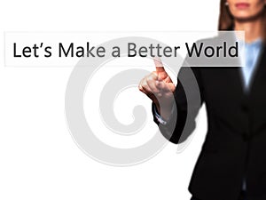 Let`s Make a Better World - Businesswoman hand pressing button photo