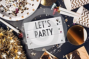 Let`s party on light box with party cup,party blower,tinsel,conf