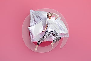 Let`s play. Full body photo of funny lady jump high hold pillow blanket flight rejoicing wear sleep mask white t-shirt