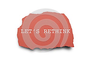 LET`S RETHINK word written under torn paper.