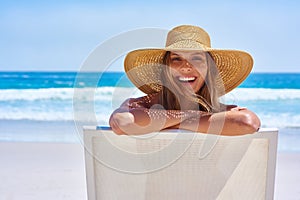 Let the summering begin. an attractive young woman enjoying a vacation at the beach.