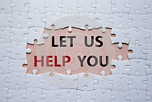 Let us help you symbol. White puzzle with words Let us help you. Beautiful pink background. Business and Let us help you concept.