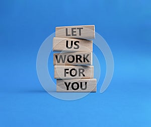 Let us work for you symbol. Wooden blocks with words Let us work for you. Beautiful blue background. Business and Let us work for