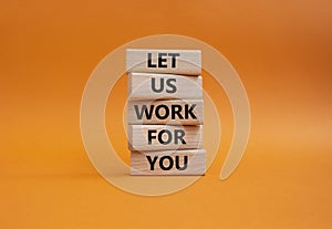 Let us work for you symbol. Wooden blocks with words Let us work for you. Beautiful orange background. Business and Let us work
