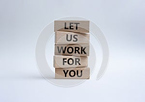 Let us work for you symbol. Wooden blocks with words Let us work for you. Beautiful white background. Business and Let us work for