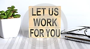 Let Us Work For You - words from wooden blocks with letters, the time is now concept