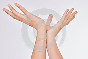 Let your divine energy flow out of you. Studio shot of an unrecognisable womans beautiful hands against a grey