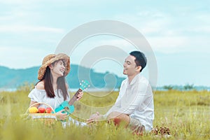 Let your life be sweet like this cake. Couple in a meadow with a birthday cake