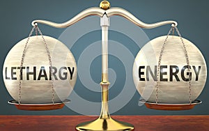 Lethargy and energy staying in balance - pictured as a metal scale with weights and labels lethargy and energy to symbolize photo