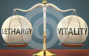 Lethargy and vitality staying in balance - pictured as a metal scale with weights and labels lethargy and vitality to symbolize photo