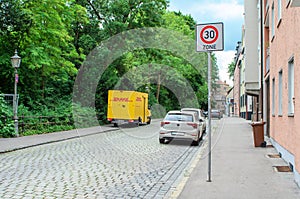 Letmathe Germany 30 June 2025 DHL van passing 30 zone sign