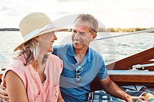 Lets get this retirement started. a mature couple enjoying a relaxing boat ride.