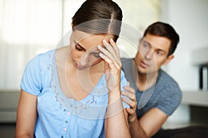 Lets not fight. a young couple having a disagreement at home.