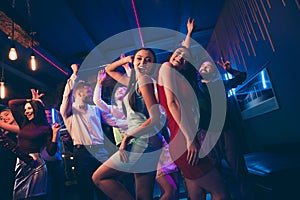 Lets party. Low angle view photo of cheerful wild crowd people dance on disco floor celebrate high-school graduation