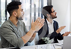 Lets put our hands together for that. two businesspeople clapping in a meeting at work.