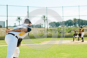 Lets start this game. a handsome young baseball player preparing to pitch a ball during a match on the field.