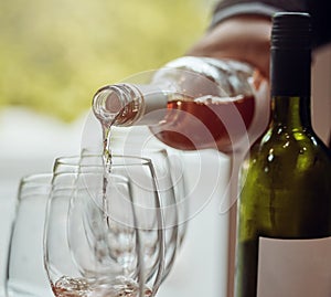 Lets start the taste test. a sommelier pouring wine into a glass.